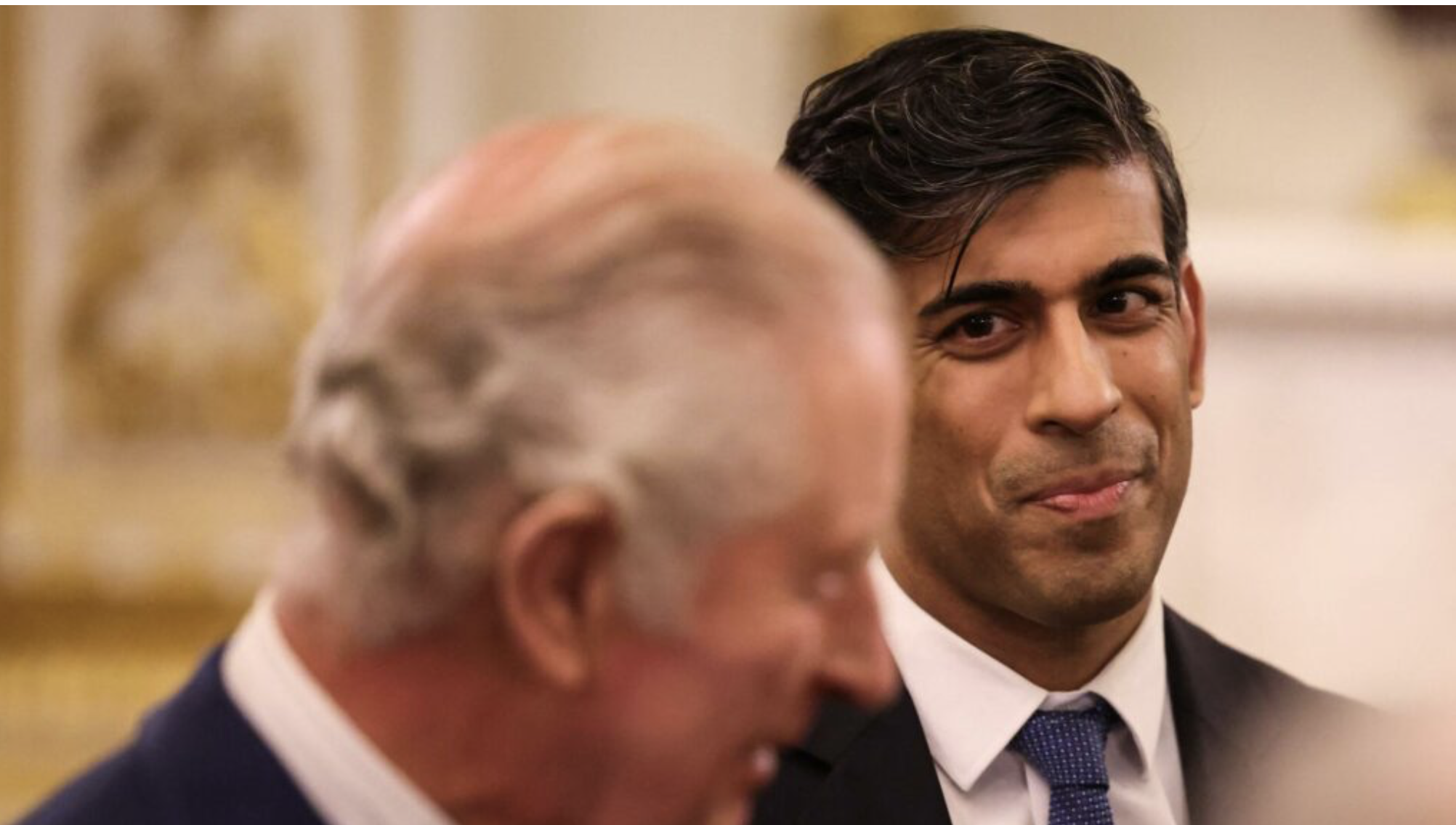 Britain's Prime Minister Rishi Sunak (C) reacts as he attends a reception at Buckingham Palace, in central London, on November 27, 2023 hosted by Britain's King Charles III (L) to mark the conclusion of the Global Investment Summit (GIS). Photo: Daniel Leal / AFP